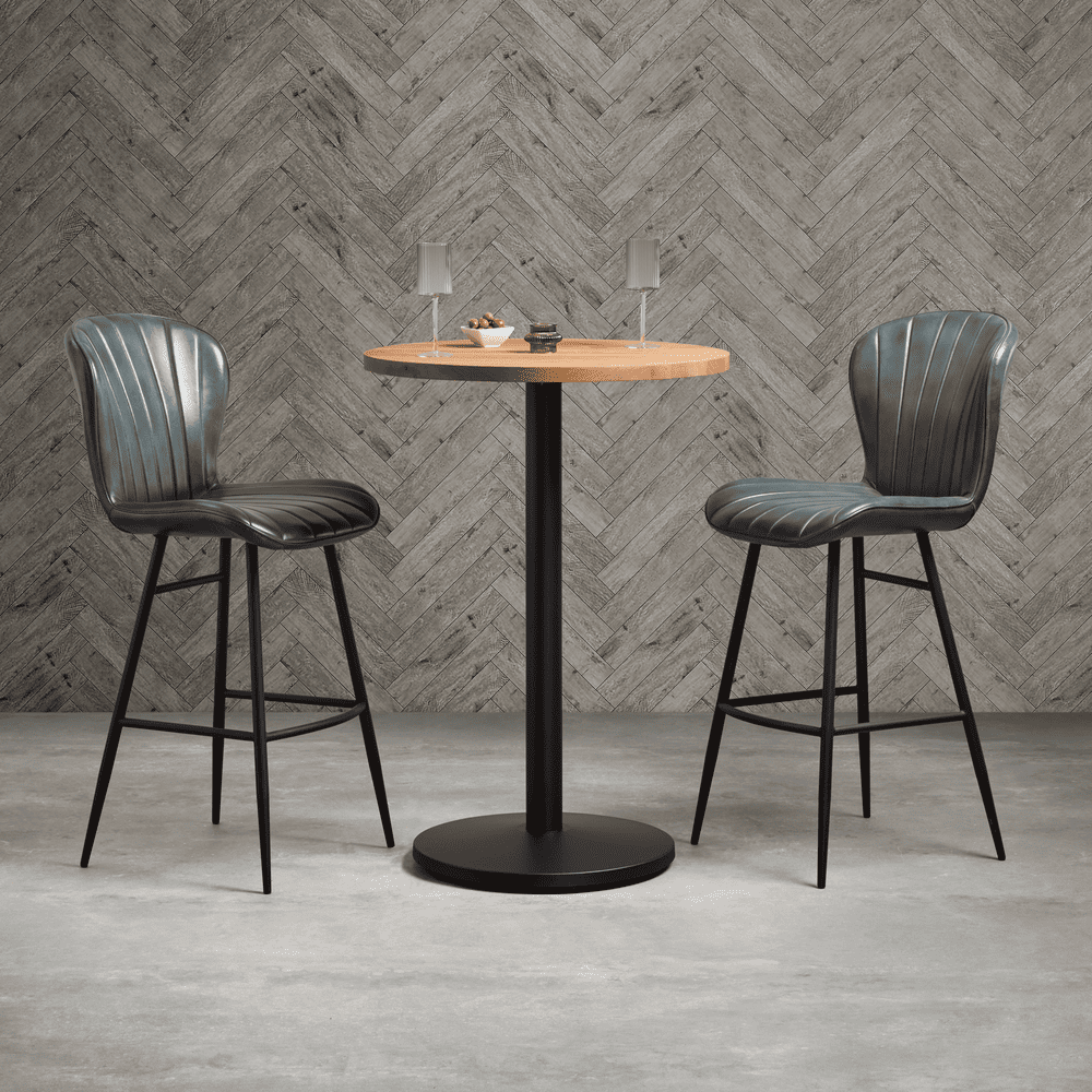 Lars bar stools with bar table in a bar setting.